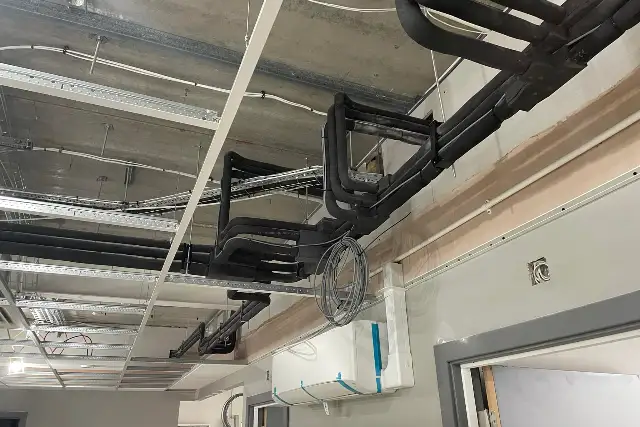 Air conditioning installation in Teesside Air conditioning installation in progress with insulated refrigerant pipework run through a ceiling void