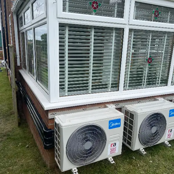 Conservatory air conditioning outdoor units Row of outdoor air conditioning units installed alongside a conservatory