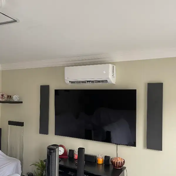 Living room air conditioning above a TV Living room air conditioning unit installed above a wall-mounted television