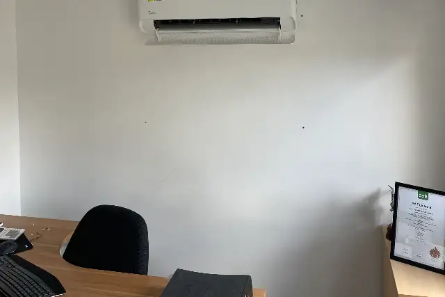 Office air conditioning in Teesside Office air conditioning unit installed above a desk in a small office